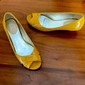 Cole Haan mustard yellow open toe wedge.